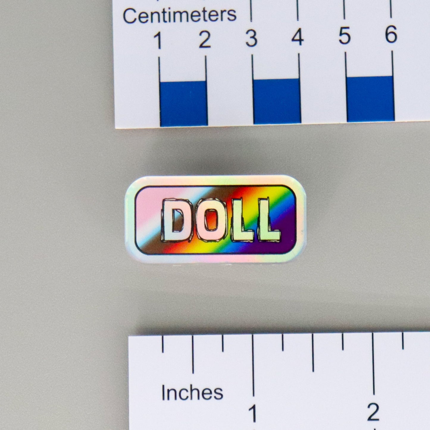 "DOLL" Mirrored Pride Pin