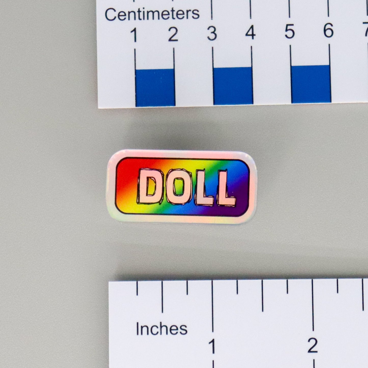 "DOLL" Mirrored Pride Pin