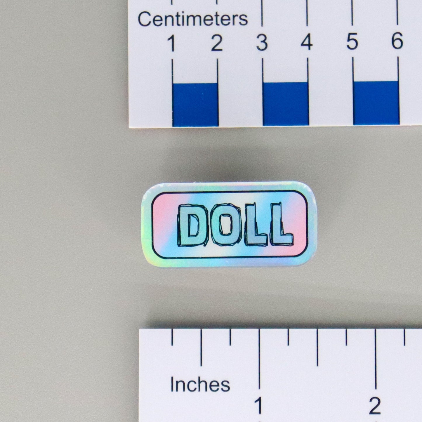 "DOLL" Mirrored Pride Pin